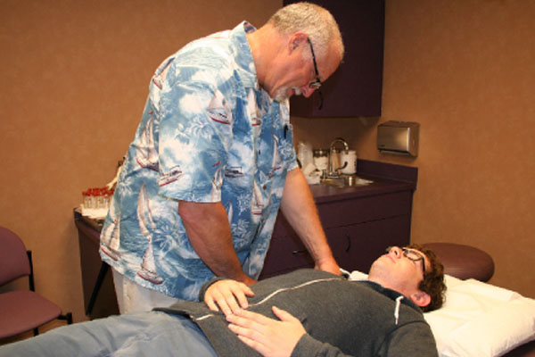 Image of a person doing osteopathic manipulation